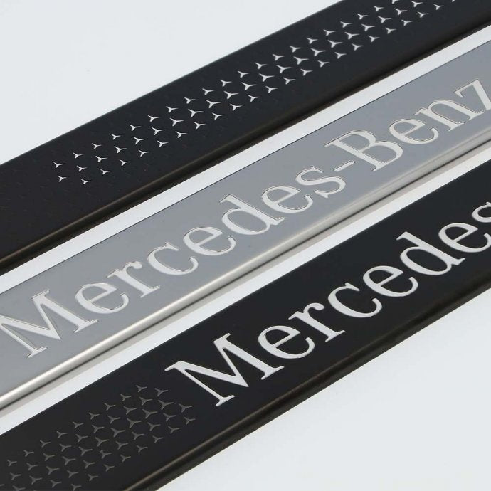 Interchangeable cover for illuminated door sill panel, Mercedes-Benz, front, 2-fold, with Mercedes-Benz pattern (black/white)